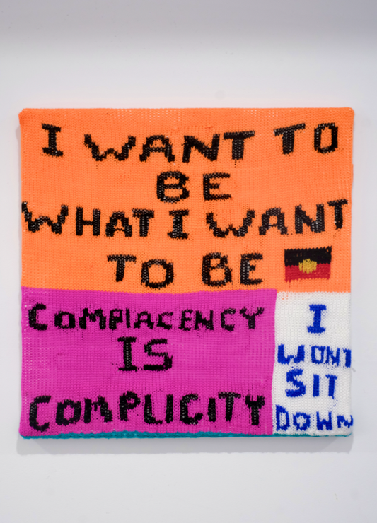 Reese Salmon - ‘Complacency Is Complicity’ knitted textile on 24”x24” canvas